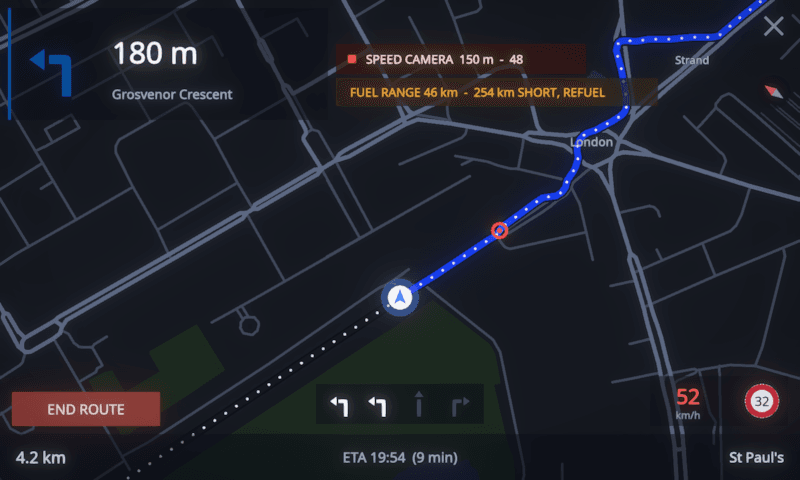MotoCore One navigation with lane-guidance arrows, a SPEED CAMERA 150 m banner and a FUEL RANGE 46 km refuel warning