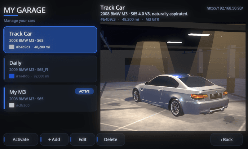MotoCore One My Garage with a three-car list beside a 3D garage hero showing a silver BMW M3 under the lamps